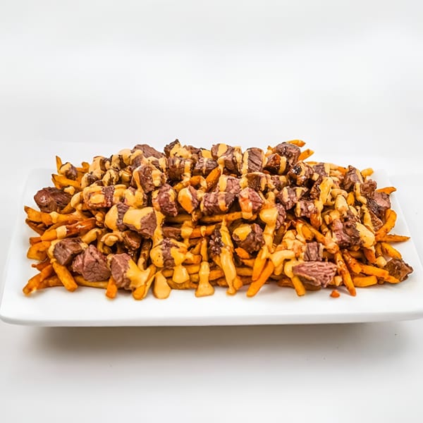 Ribline BBQ's loaded fries, topped with generous chunks of steak and drizzled with cheese sauce.